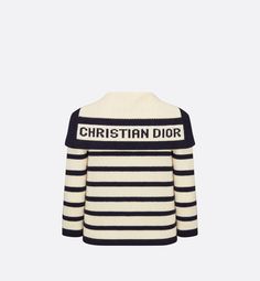 The virgin wool and cashmere knit Dior Marinière cardigan is adorned with the timeless D-Stripes motif in navy blue and ecru. Its cropped, fitted cut features contrasting navy blue edges and a sailor collar with the Christian Dior signature. Classic and modern at the same time, the cardigan will complete any outfit through the seasons.. 36 Dior Cardigan, Dior Sweater, Denim Swimsuit, Blanket Poncho, Icon Shoes, Dior Book Tote, Spring Capsule, Christian Dior Couture, Sailor Collar