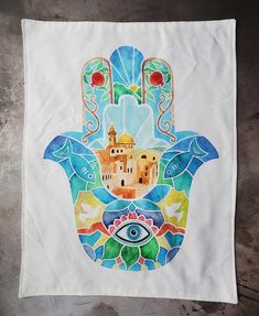 the hamsa is painted with colorful designs on it