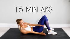 a woman in white top and blue leggings sitting on black mat with text overlay that reads 15 min abs