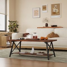 a living room with a white couch and coffee table