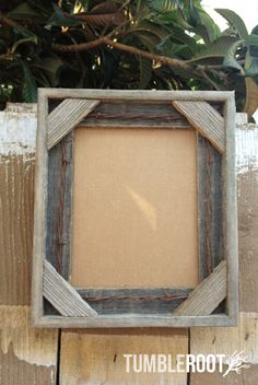 an old wooden frame with rope around it