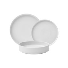 two white plates sitting next to each other