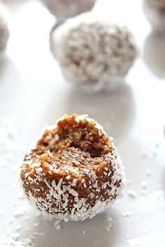 some sugar coated donuts are on a white surface