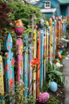 colorful picket fence with painted eggs and flowers