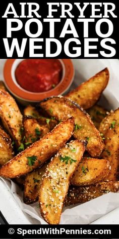 air fryer potato wedges in a basket with ketchup on the side