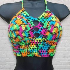 Halter top perfect for hot and sunny days and dancing away the nights at your favorite summer festival, lounging by the pool, or walking on the beach.  Corset style lace up back and ties around the neck, making it adjustable to fit different sizes.  Pictured in Neon Blacklight and is blacklight responsive!  Want padding added? Add this listing to your order and choose from either push up or regular foam padding. https://www.etsy.com/listing/399021473/add-padding-to-your-crochet-top Neon Crochet, Robe Diy, Summer Top Pattern, Cute Summer Tops, Crochet Tops Free Patterns, Fairy Clothes, Womens Halter Tops, Crochet Summer Tops, Rainbow Crochet