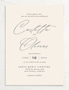 an elegant calligraphy wedding card with the words,'love is in the air '