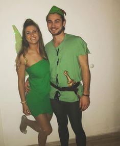 a man and woman dressed up in costumes