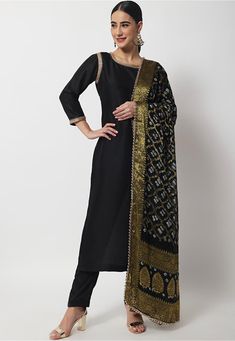 Readymade Art Dupion Silk Pakistani Suit in Black This Round Neck and Quarter Sleeves attire with Cotton Lining is Enhanced with Gota Patti Patch Work Available with a Art Dupion Silk Pant in Black and a Faux Georgette Jacquard Dupatta in Black The Kameez and Bottom Lengths are 46 and 38 inches respectively Do Note: Accessories shown in the image are for presentation purposes only and length may vary upto 2 inches.(Slight variation in actual color vs. image is possible). Bandhej Pattern, Black Suit Combinations, Bandhej Dupatta, Black Kurti, Suit Combinations, Straight Kurti, Pakistani Suit, Georgette Dupatta, Black Pure