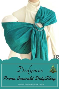 a woman wearing a green shawl with the words didymos prima emerald diy sling on it