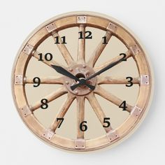 a clock made out of wood with numbers on the front and side of it's face