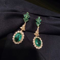 Expertly crafted with green cubic zirconia stones, these earrings add a pop of color to any outfit. The broken design adds a unique touch, making them a conversation starter. - Color: Green- Style: Earrings- Closure Type: Stud- Stone Type: Zircon- Gender: Women Fine Jewelry Green Diamond Earrings, Elegant Green Emerald Diamond Earrings, Green Diamond Drop Earrings, Green Cubic Zirconia Fine Jewelry Earrings, Fine Jewelry Green Drop Earrings, Green Cubic Zirconia Earrings Fine Jewelry, Green Fine Jewelry Drop Earrings, Green Dangle Jewelry With Plating, Elegant Green Diamond Drop Earrings