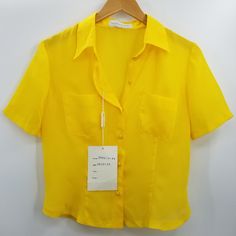 Franca Gualtieri Yellow Button Short Sleeve Sheer Blouse Size 44 Italy Which Is Equivalent To A Us Large 100% Polyester Measurements Are Taken Laying Flat And Are Approximate Colors May Differ Slightly From Photos Based On The Device Used To View & Color Settings. Fast Shipper All Items Have An Inventory Tag Attached Which Ensures You're Getting The Item Pictured And Must Remain Attached For A Return 20541 Solid Blouse With Snap Buttons For Spring, Elegant Yellow Summer Shirt, Classic Summer Shirt With Back Button Closure, Collared Summer Blouse With Buttons, Yellow V-neck Blouse With Buttons, Summer Button-up Blouse With Button Closure, Summer Blouse With Collar And Button Closure, Elegant Yellow Collared Shirt, Elegant Summer Top With Snap Buttons