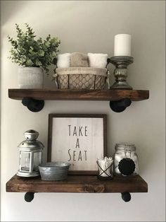 two wooden shelves with candles and other items on them