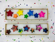 two boxes filled with different colored stars next to each other