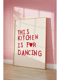 this kitchen is for dancing poster on the floor in front of a pink painted wall