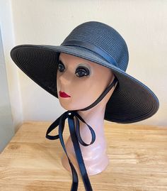 This black 4 inch down turn brim Toyo straw hat is very durable and keeps the shape, great for travel. The hat has a removable black or white raw edged Grosgrain ribbon and under chin tie. The hat will fit up to 22 5/8 inch head size with an inside sizing cord to adjust to your head size. You can easily remove the tie and use another ribbon to match your outfit. The ribbon is also available in rose pink.  NOTE: Please check the head size before purchase, I am happy to answer any questions you ma Black Sunhat, Beach Hat, Cool Hats, White Ribbon, Brim Hat, Sun Hat, Wide Brimmed, Straw Hat, Rose Pink