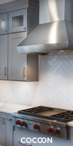 a stove top oven sitting inside of a kitchen next to cabinets and cupboards on the wall