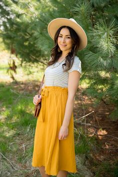 Tie Midi Skirt - $38.00 - 100% Cotton.    Do Not Bleach. Hang/Lay Flat to Dry. - Betsey's Boutique Shop Versatile Midi Length Summer Bottoms, Versatile Midi Maxi Skirt For Spring, Versatile Midi-length Summer Bottoms, Versatile Midi Length Skirt For Day Out, Versatile Midi Skirt For Spring, Summer Flowy Skirt With Tie Waist, Versatile Summer Maxi Skirt For Day Out, Relaxed Midi Wrap Skirt With Tie Waist, Modest Spring Midi Skirt