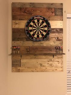 a dart board mounted to the side of a wall