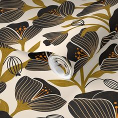 a wallpaper with black and gold flowers on it