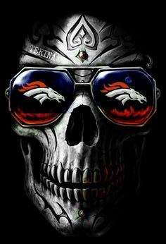 a skull wearing sunglasses with flames on it