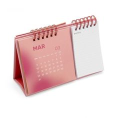 a pink desk calendar with the word mar on it's front and side pages