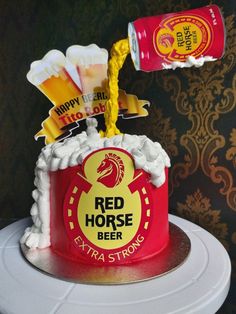 a red horse beer cake with white frosting