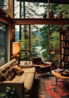 a living room filled with furniture next to a window covered in lots of books and plants