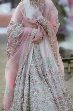 a woman in a pink and silver outfit