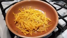 cheese is being cooked in a frying pan on the stove top, ready to cook