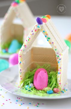 an easter egg house made out of wafer paper and decorated with sprinkles