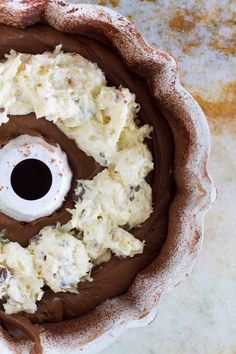 an overhead view of a cake with chocolate frosting