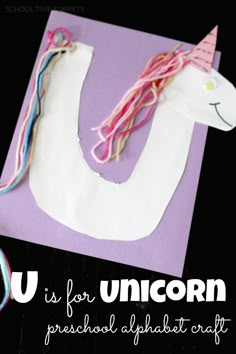 an unicorn made out of paper and yarn with the words u is for unicorn preschool alphabet craft