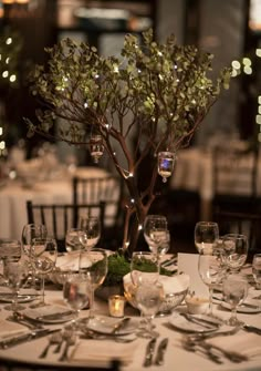 the table is set with silverware and place settings