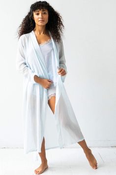 This robe is a Salua classic made of our cotton/silk. It is 48" long. It pairs beautifully with the Birdies and Bettys. It features a tie that is attached at the back. This robe is so elegant and a classic style that every woman needs. Shown here in 48". Made in Colombia 30% Silk/70% Cotton Spring Daywear Wrap Robe, Elegant Cotton Robe For Daywear, Spring Long Robe For Home, Long Spring Robe For Home, Elegant Cotton Daywear Robe, Comfortable Long Spring Sleepwear, Elegant Fitted Cotton Robe, Long Sleepwear For Spring Relaxation, Summer Cotton Robe For Daywear