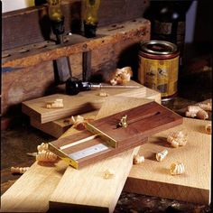 a couple of pieces of wood sitting on top of a table next to some garlic