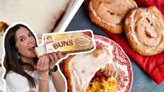 a woman holding a box of krispy kreme buns next to a plate of doughnuts