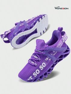 a pair of purple shoes with white lettering on the soles and bottom part of the shoe