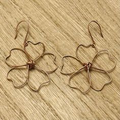 Handcrafted using high-quality copper and silver wire. The copper earring hooks are handmade.  Hypoallergenic and nickel-free! Dimensions: 1.5" diameter flower, 2" total drop length. These are delicate, very light-weight, and are sealed with a protective coating for longevity. It is recommended that in order to preserve the life of these earrings, even when sealed, please remove them before engaging in water or strenuous activities (sports, exercising, swimming, etc.). Rose Gold Flower-shaped Metal Earrings, Rose Gold Flower-shaped Earrings With Ear Wire, Rose Gold Flower Shaped Earrings, Copper Drop Earrings With Flower And Ear Wire, Copper Drop Flower Earrings With Ear Wire, Nickel-free Copper Flower Drop Earrings, Nickel Free Rose Gold Copper Wire Earrings, Nickel-free Flower-shaped Copper Jewelry, Nickel-free Copper Flower Jewelry