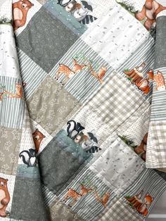 an image of a baby quilt with animals on it's back and the bottom half