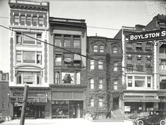 an old black and white photo of buildings