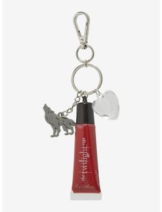 a keychain with a toothbrush and an animal charm on it's side