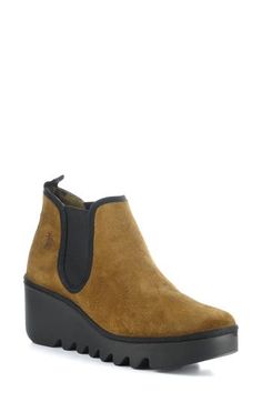 Fly London's signature wedge and a cushioned footbed elevate this this versatile Chelsea boot. 3" heel; 1 1/4" platform 3 1/2" shaft Pull-on style with elastic gore insets Cushioned insole Leather upper/synthetic lining/rubber sole Made in Portugal Women's Shoes Chelsea Boot Women, Fly London, Chelsea Boot, Wedge Boots, Boot Shoes Women, Arkansas, Chelsea Boots, Women's Shoes, Rubber Sole