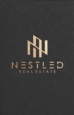 the nested real estate logo is shown in gold on black paper with metallic foil