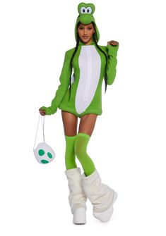 a woman in a frog costume is holding a ball and wearing white boots with green socks