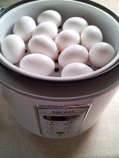 a crock pot filled with hard boiled eggs