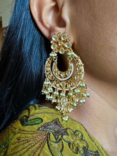 This intricately handmade pair with pearl drops is perfect for any traditional look.  You will definitely fall in love with these sabyasachi kundan earrings. Light weight and comfortable. One of our favourite picks for the wedding season . Be bold, be stylish, and be your best always. The weight of the earrings is 44 g. The length of the earrings is 9 cm. The width of earrings is 5 cm. Festive Heavy Kundan Pearl Earrings, Bollywood Style Kundan Pearl Earrings With Meenakari, Festive Kundan Chandbalis With Pearl Drop, Kundan Pearl Earrings For Festivals In Temple Jewelry Style, Festive Kundan Pearl Drop Earrings, Festive Kundan Pearl Earrings, Festive Kundan Danglers With Pearl Drop, Kundan Pearl Drop Bridal Earrings For Diwali, Festive Kundan Pearl Earrings With Latkans