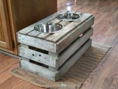 two wooden crates stacked on top of each other with one bowl and the other empty