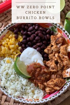 a bowl filled with chicken, rice and beans